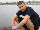 Jamie On Rock Kneeling At Mission Bay